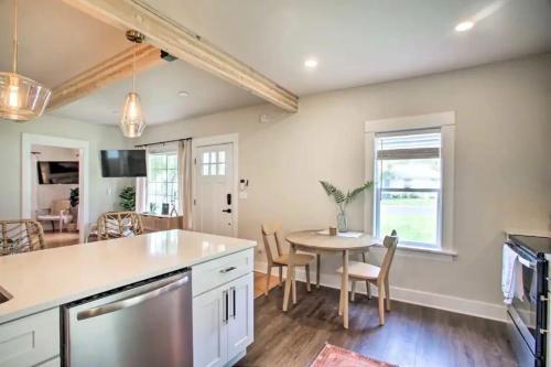a kitchen and dining room with a table and chairs at Cheerful 3 bedroom Villa with Backyard Oasis in Spokane