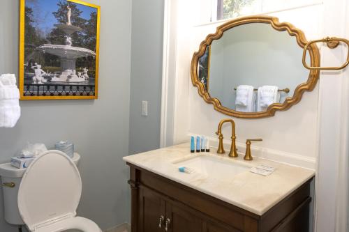 a bathroom with a sink and a mirror at Eliza Thompson House, Historic Inns of Savannah Collection in Savannah