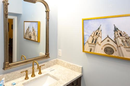 a bathroom with a sink and a mirror at Eliza Thompson House, Historic Inns of Savannah Collection in Savannah