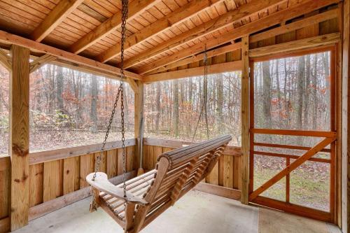 a porch with a hammock in a log cabin at Navajo in Logan