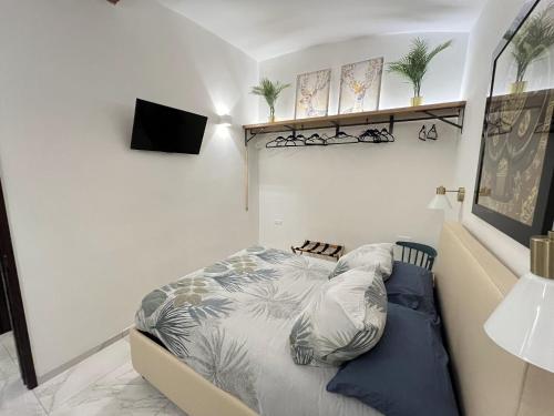 Ένα ή περισσότερα κρεβάτια σε δωμάτιο στο IL POSTO CHE NON TI ASPETTI centro storico