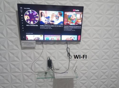 Uma televisão e/ou sistema de entretenimento em Casa Arraial do Cabo - Figueira