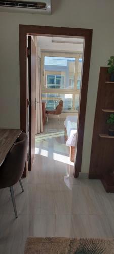 a room with a view of a bedroom with a mirror at Hurghada Mirage Bay Hotel & Aquapark in Hurghada