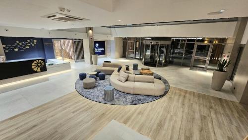 a large living room with couches and a table at Crystal Baltic 222 in Dziwnówek