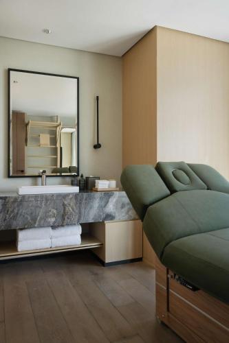 a bathroom with a sink and a large mirror at SIRO One Za'abeel in Dubai