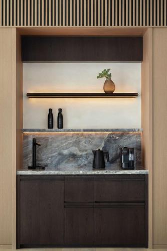 a kitchen with a sink and a counter top at SIRO One Za'abeel in Dubai
