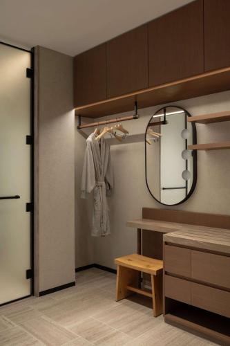 a dressing room with a mirror and a dressing table at SIRO One Za'abeel in Dubai