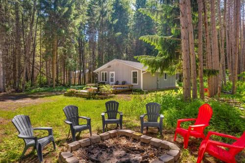 a group of chairs around a fire pit in a yard at Shanty Creek, Golf, Families, Vacation, Pool Pass in Bellaire