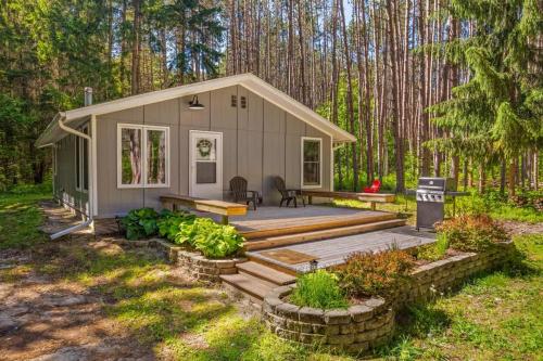 a tiny house in the middle of a forest at Shanty Creek, Golf, Families, Vacation, Pool Pass in Bellaire