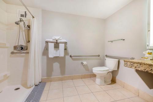 a white bathroom with a toilet and a shower at Best Western Plus Bayside Inn in San Diego