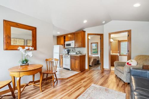 a kitchen and living room with a table and a couch at Old Fashioned by Simple Life Rentals in Fish Creek