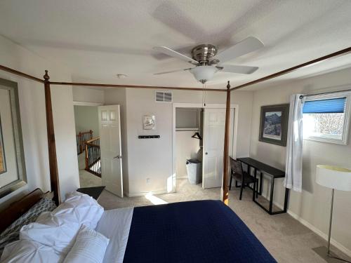a bedroom with a bed and a ceiling fan at Tiller House - Savannah Room in Windsor