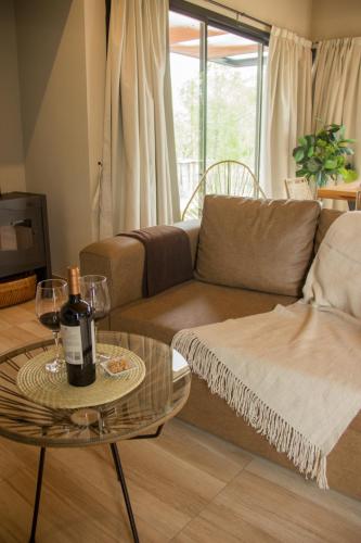 a living room with a couch and a table at Blend Lodges in Tunuyán
