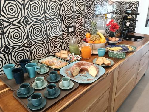 a buffet with a breakfast of bread and fruit at B&B Il Castello in Rome