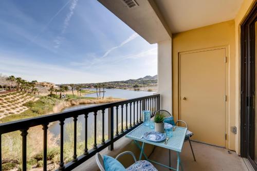 a balcony with a table and a view of a river at Oasis on Lake Las Vegas in Henderson