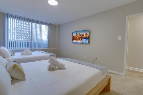 a bedroom with two beds and a window at Prime Location! 2BR Apartment in Crystal City in Arlington