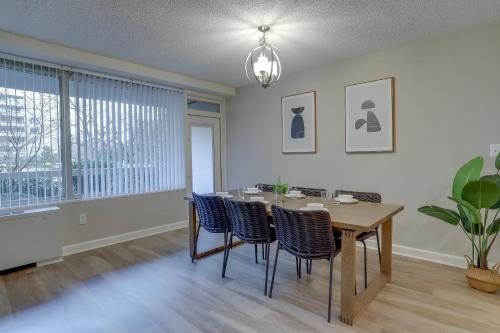 a dining room with a table and chairs at Prime Location! 2BR Apartment in Crystal City in Arlington
