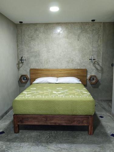 a bedroom with a bed in a room at Casa Lomas Grangelo in Atlixco