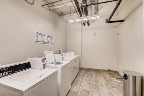 a white laundry room with white appliances in it at Oasis on Lake Las Vegas in Henderson