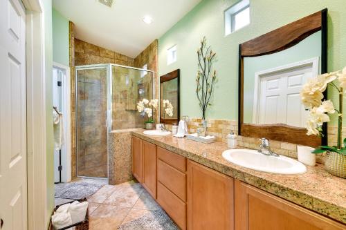 a bathroom with two sinks and a shower at Private Pool and Patio Desert Hot Springs Retreat in Desert Hot Springs