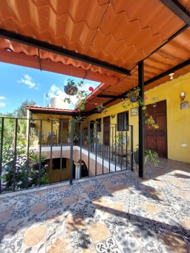 an outside view of a house with an orange roof at Hotel Nolasco in Antigua Guatemala