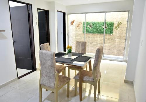 a dining room with a table and chairs at Hotel Iguaraya Inn in Ríohacha