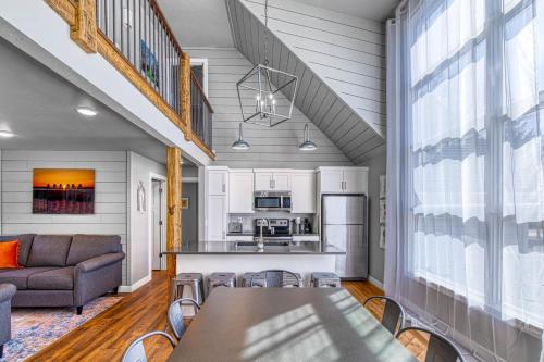 a kitchen and living room with a table and chairs at Westeros by Simple Life Rentals in Ephraim