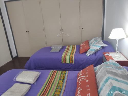 two beds sitting next to each other in a room at Buenos Aires, CABA in Buenos Aires