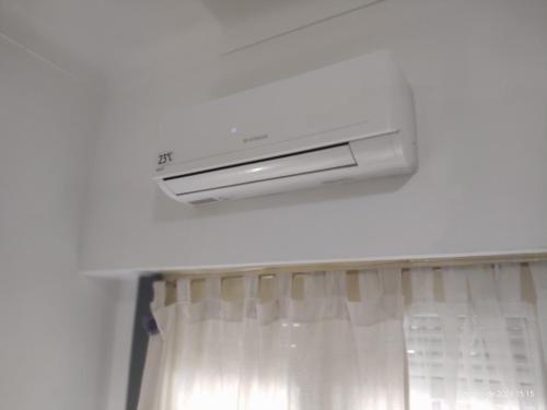 a bathroom with a air conditioner hanging from the ceiling at Buenos Aires, CABA in Buenos Aires