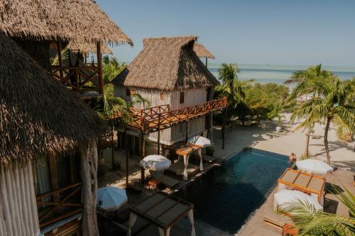 an aerial view of a resort with a swimming pool at Aldea Kuká, Luxury Eco Boutique Hotel in Holbox Island
