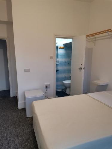 Ένα ή περισσότερα κρεβάτια σε δωμάτιο στο ABC Bed and Breakfast