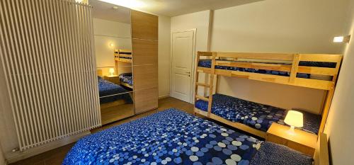 Postel nebo postele na pokoji v ubytování Bilocale nel Resort con terrazzo - Val di Luce