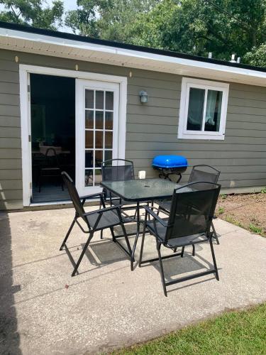 a picnic table and chairs in front of a house at 208 Gunter in Saint Marys