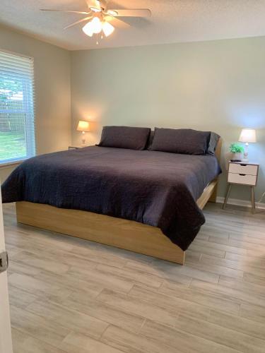 a bedroom with a bed and a ceiling fan at 208 Gunter in Saint Marys