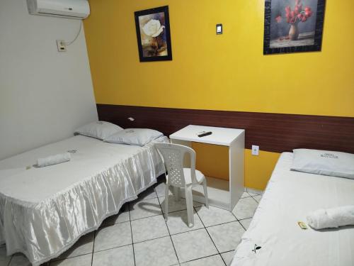 Katil atau katil-katil dalam bilik di HOTEL NOVAES