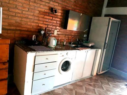 Kuchyň nebo kuchyňský kout v ubytování Casa quincho don Octavio
