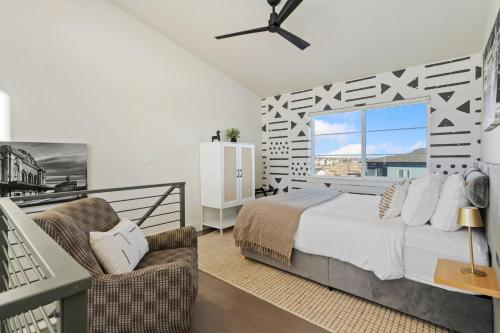 a bedroom with a large bed and a balcony at Mountain View Home with King Beds and Rooftop Deck in Fort Collins