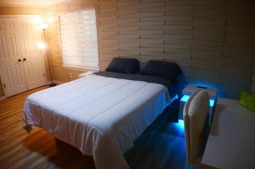 a bedroom with a large bed in a room at The Trace Elegant Eclectic Home with patio in Smyrna Ga in Smyrna