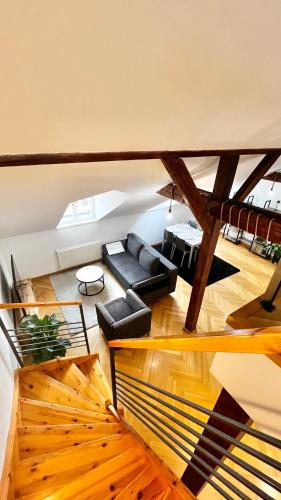a living room with a couch and a table at Miru Loft Prague in Prague