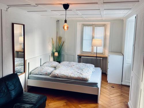 Postel nebo postele na pokoji v ubytování Cozy Little Apartment