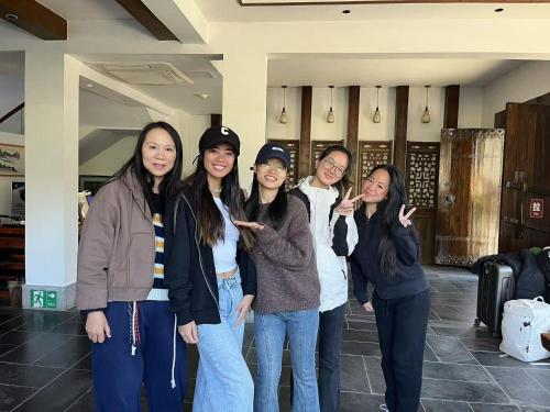 a group of women posing for a picture at Serene Vale Inn Railway station free pick-up by 2 nights English and Spanish reception available in Guilin