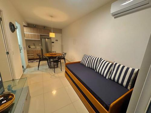 a living room with a couch and a table at Fortaleza VG Fun Flats Sol e Mar in Fortaleza