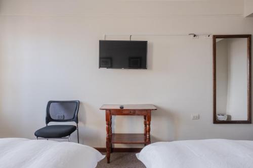 TV a/nebo společenská místnost v ubytování Hotel Santa Cruz