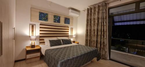 Ένα ή περισσότερα κρεβάτια σε δωμάτιο στο LA VILLA 1 Deluxe3 Mont Choisy MAURITIUS