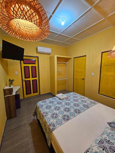 a bedroom with a large bed in a room at Casa de Luna in La Dorada