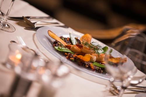 a plate of food with vegetables on a table at Hotel Niedersächsischer Hof in Bad Bentheim