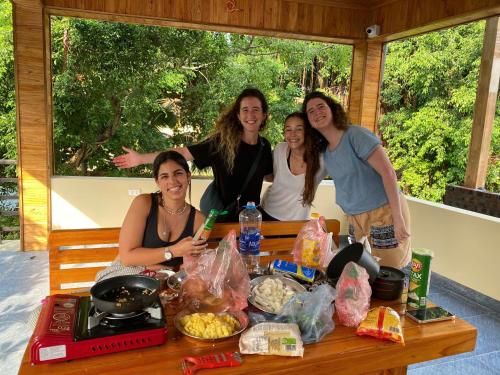 a group of women standing around a table with food at Tam Coc Westlake Homestay in Ninh Binh