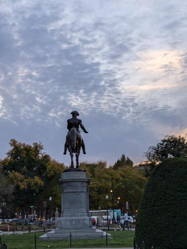 a statue of a man on a horse in a park at Boston Homestel in Boston