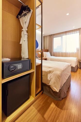 Ένα ή περισσότερα κρεβάτια σε δωμάτιο στο Hotel Uri&