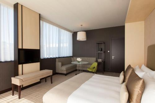 Postel nebo postele na pokoji v ubytování Crowne Plaza Geneva by IHG